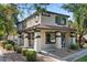 Charming two-story home featuring a cozy front porch with stylish columns and manicured landscaping at 1531 S Owl Dr, Gilbert, AZ 85296