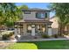 Charming two-story home featuring a cozy front porch with stylish columns and manicured landscaping at 1531 S Owl Dr, Gilbert, AZ 85296