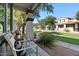 Cozy front porch with comfortable seating and a view of the landscaped lawn and neighborhood at 1531 S Owl Dr, Gilbert, AZ 85296