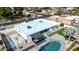 Aerial view of a modern home featuring a pool, basketball court, and outdoor entertainment area at 15609 N 59Th St, Scottsdale, AZ 85254