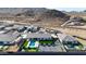 Luxury estate with pool, putting green, and tennis court set against a stunning mountain backdrop at 16832 E Hazeltine Way, Queen Creek, AZ 85142