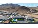 Luxury estate with pool, putting green, and tennis court set against a stunning mountain backdrop at 16832 E Hazeltine Way, Queen Creek, AZ 85142