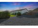 Sprawling backyard boasts mature landscaping and privacy with scenic mountain views at 16832 E Hazeltine Way, Queen Creek, AZ 85142
