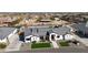 Charming single-Gathering home with a modern design, manicured lawn, and beautiful landscaping at 16832 E Hazeltine Way, Queen Creek, AZ 85142