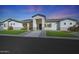 Charming home featuring a well-manicured lawn, a symmetrical design, and a welcoming entrance at 16832 E Hazeltine Way, Queen Creek, AZ 85142