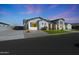 Beautiful single-Gathering home featuring modern farmhouse architecture, landscaping, and a spacious driveway at 16832 E Hazeltine Way, Queen Creek, AZ 85142