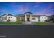Charming home featuring a well-manicured lawn, a symmetrical design, and a welcoming entrance at 16832 E Hazeltine Way, Queen Creek, AZ 85142