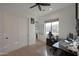 Well lit home office with fan, closet, large window, and an ergonomic chair at 16832 E Hazeltine Way, Queen Creek, AZ 85142