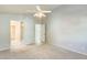 Neutral bedroom with a ceiling fan with attached bathroom and closet at 17132 N Silver Path, Surprise, AZ 85374