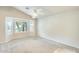 Spacious bedroom with large windows, plantation shutters, and neutral carpeting at 17132 N Silver Path, Surprise, AZ 85374