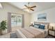 Comfortable bedroom with a ceiling fan, neutral walls, and a window for plenty of sunlight at 17132 N Silver Path, Surprise, AZ 85374