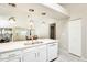 Bright kitchen featuring white cabinets, modern appliances, a countertop island, and seamless sightlines to dining spaces at 17132 N Silver Path, Surprise, AZ 85374