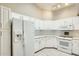 The kitchen features white cabinets, subway tile backsplash, and modern appliances, including a refrigerator and range at 17132 N Silver Path, Surprise, AZ 85374