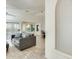 Open living space with tile floors, neutral paint, large windows, and comfortable seating at 17132 N Silver Path, Surprise, AZ 85374