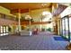 Inviting community lobby features high ceilings, comfortable seating areas, and elegant chandeliers at 17132 N Silver Path, Surprise, AZ 85374