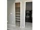 Functional pantry area featuring shelving, adjacent to laundry room with modern washer and dryer set at 17132 N Silver Path, Surprise, AZ 85374