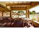 Charming poolside dining area with tables and chairs, perfect for enjoying meals by the community pool at 17132 N Silver Path, Surprise, AZ 85374
