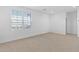 Bedroom with neutral carpet and window at 17731 W Hatcher Rd, Waddell, AZ 85355