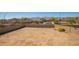 Expansive backyard space with block wall offering privacy and potential for customization at 18431 W Cinnabar Ave, Waddell, AZ 85355