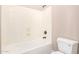 Clean bathroom with a white bathtub, shower, and toilet, offering a functional space at 18431 W Cinnabar Ave, Waddell, AZ 85355