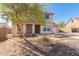 Beautiful two-story home featuring a manicured front yard with a brick pathway leading to the front door at 18431 W Cinnabar Ave, Waddell, AZ 85355