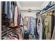 Organized walk-in closet with clothing racks, shelves, and storage solutions at 18614 N Conestoga Dr, Sun City, AZ 85373
