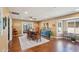 Open concept dining area with wood floors and a large blue console table at 18614 N Conestoga Dr, Sun City, AZ 85373