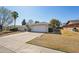 Charming single-story home with a well-maintained lawn and a spacious two-car garage at 18614 N Conestoga Dr, Sun City, AZ 85373