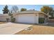Spacious two-car garage and well maintained lawn at 18614 N Conestoga Dr, Sun City, AZ 85373