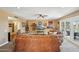 Bright living room with a ceiling fan, plush furniture, and decorative shelves at 18614 N Conestoga Dr, Sun City, AZ 85373