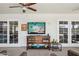 Sun room features a console and large TV for relaxing at 18614 N Conestoga Dr, Sun City, AZ 85373