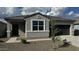 Charming single-story home featuring a neutral gray exterior, xeriscaped front yard, and attached garage at 18878 E Bruno Dr, Gold Canyon, AZ 85118