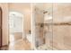 Bathroom showcasing walk-in shower, soaking tub, and tile floors; access to the bedroom at 19226 N Cave Creek Rd # 109, Phoenix, AZ 85024