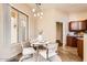 Cozy dining area with stylish lighting fixture and ample natural light at 19226 N Cave Creek Rd # 109, Phoenix, AZ 85024