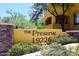 Inviting community sign with lush landscaping and unique southwestern architecture at 19226 N Cave Creek Rd # 109, Phoenix, AZ 85024