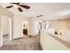 Open-concept hallway with ceiling fan leading to the bathroom and other rooms at 19226 N Cave Creek Rd # 109, Phoenix, AZ 85024