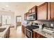 Well-appointed kitchen with stainless steel appliances and modern finishes at 19226 N Cave Creek Rd # 109, Phoenix, AZ 85024
