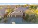 Expansive aerial view of a lovely home with a three-car garage and desert landscaping at 19240 N 90Th Pl, Scottsdale, AZ 85255
