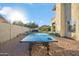 Spacious backyard with a ping pong table, artificial grass, and beautiful desert landscaping at 19240 N 90Th Pl, Scottsdale, AZ 85255