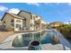 Beautiful backyard pool with mature landscaping, large patio, and outdoor cooking area at 19240 N 90Th Pl, Scottsdale, AZ 85255