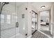 Walk-in shower features white subway tiles, a glass enclosure, and a built in bench at 19240 N 90Th Pl, Scottsdale, AZ 85255