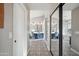 Hallway to a luxurious bathroom with patterned floors, double sinks, and a glass shower at 19240 N 90Th Pl, Scottsdale, AZ 85255