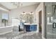 Light-filled bathroom features patterned floors, double sinks, soaking tub, and a separate glass shower at 19240 N 90Th Pl, Scottsdale, AZ 85255
