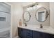 Stylish bathroom with a double vanity and a beautifully tiled shower at 19240 N 90Th Pl, Scottsdale, AZ 85255