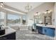Luxurious bathroom with a soaking tub, chandelier and double vanity at 19240 N 90Th Pl, Scottsdale, AZ 85255