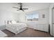 Bright bedroom featuring a bed, a ceiling fan, and a window for ample light at 19240 N 90Th Pl, Scottsdale, AZ 85255