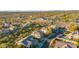 Expansive aerial view of a desert community with lush trees and manicured desert landscaping at 19240 N 90Th Pl, Scottsdale, AZ 85255