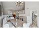 Open-concept dining area featuring a large chandelier and comfortable seating at 19240 N 90Th Pl, Scottsdale, AZ 85255