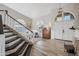 Elegant foyer featuring high ceilings, a staircase, and views of the living spaces at 19240 N 90Th Pl, Scottsdale, AZ 85255