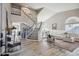 Grand foyer featuring high ceilings, a staircase, and a view into the formal living room at 19240 N 90Th Pl, Scottsdale, AZ 85255